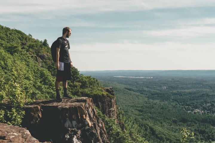 man standing on the cliff