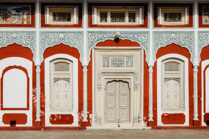 red and white framed beige doors