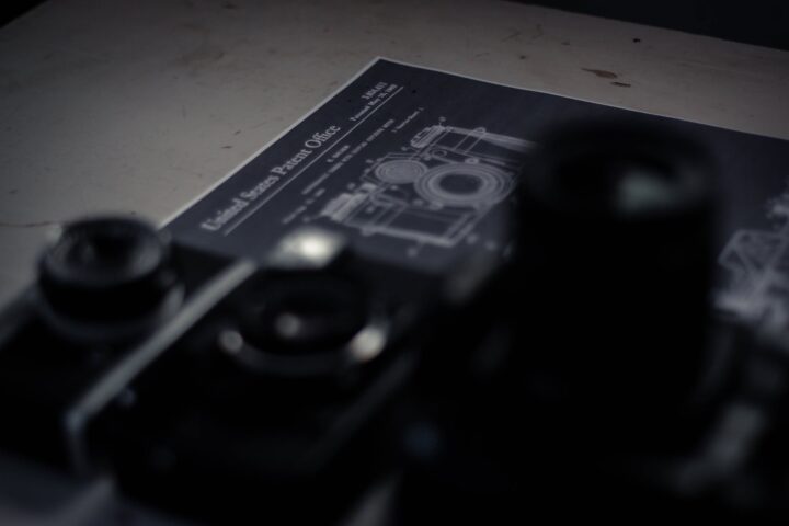 patented vintage cameras placed on table