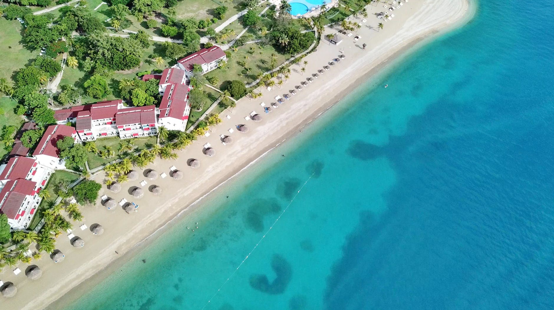 aerial photography of turquoise water on the sea