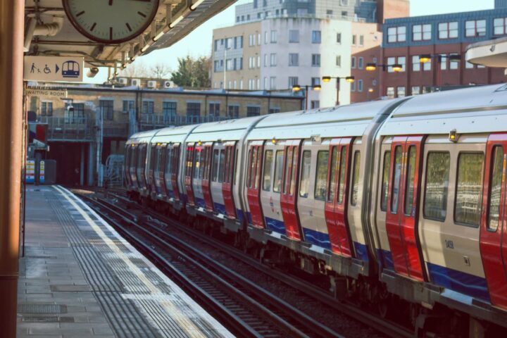 gray and red train on subway