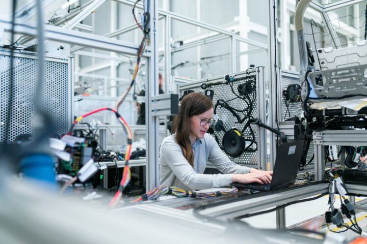 photo of female engineer working on her workspace