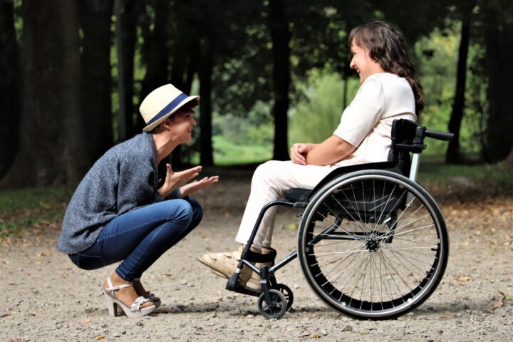 woman on black folding wheelchair