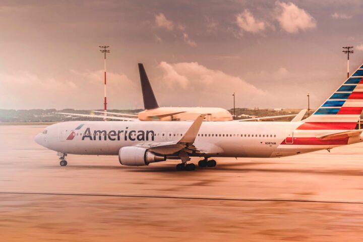 white american airplane parked on airport