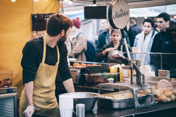 man standing in front of bowl and looking towards left