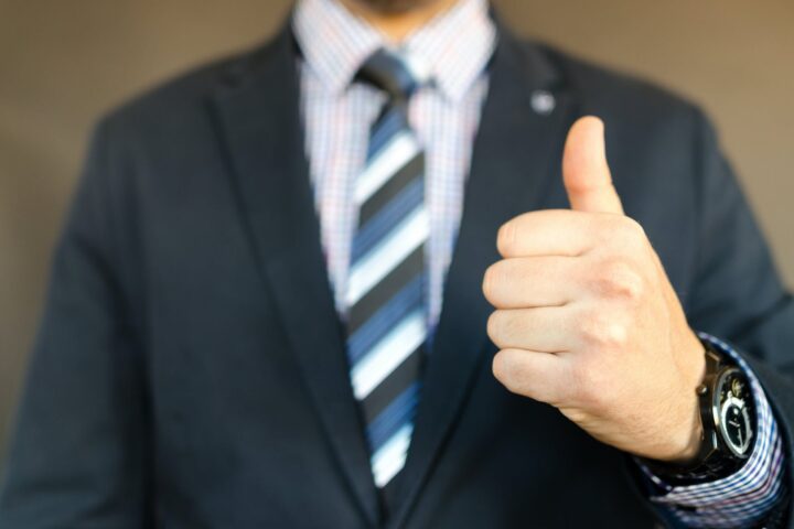 man in black formal suit jacket