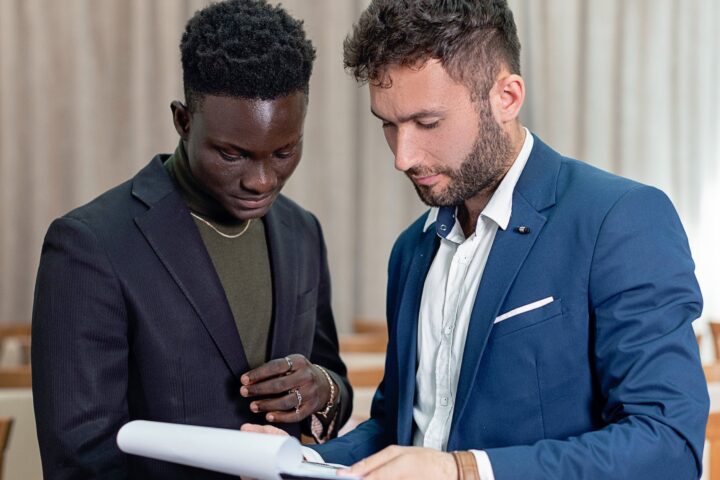 office workers looking at a document and talking