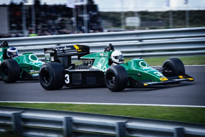 man riding on racing car